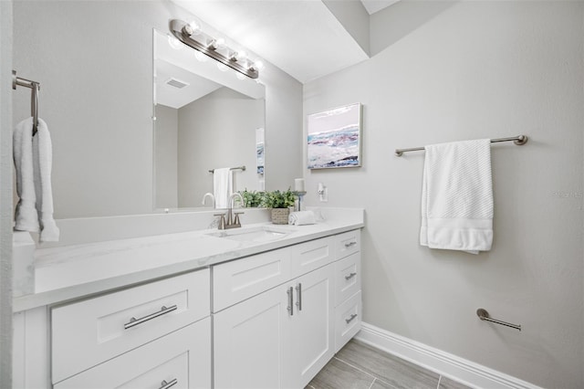 bathroom featuring vanity and hardwood / wood-style floors