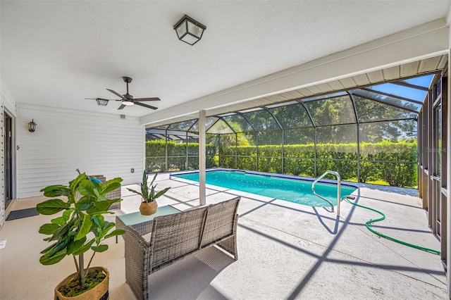 view of pool with ceiling fan, a lanai, and a patio area