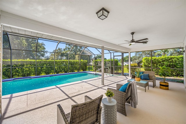 view of swimming pool with a patio, an outdoor living space, ceiling fan, and glass enclosure