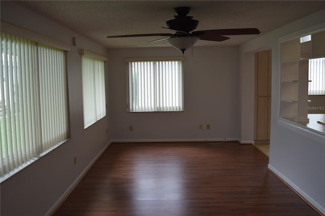 interior space featuring a textured ceiling, dark hardwood / wood-style flooring, and ceiling fan