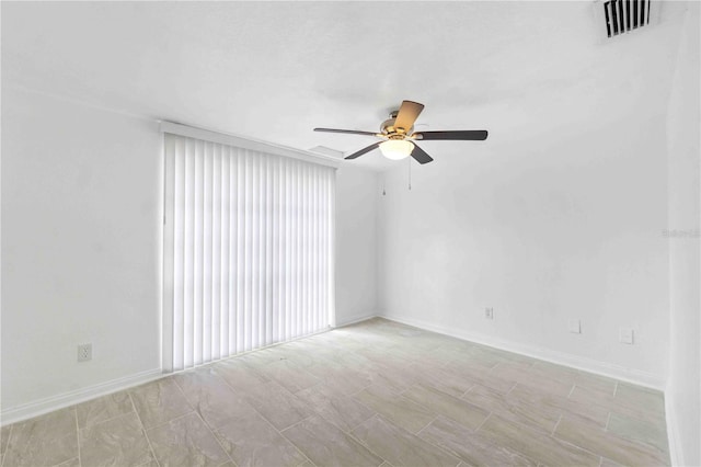 unfurnished room with ceiling fan