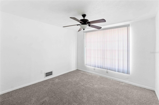 carpeted empty room with ceiling fan