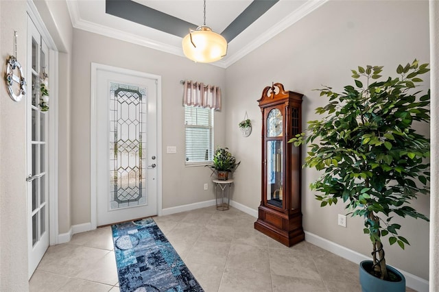 entryway with french doors, light tile patterned floors, and ornamental molding