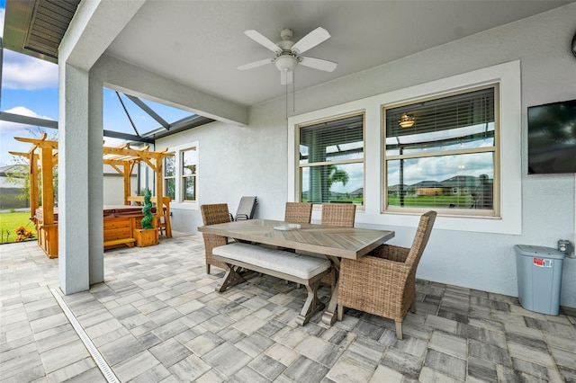 view of patio / terrace with a hot tub and ceiling fan