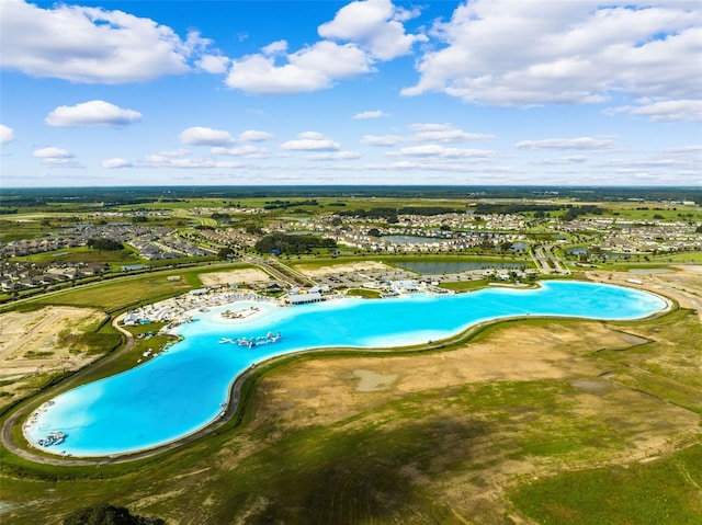 view of swimming pool with a water view