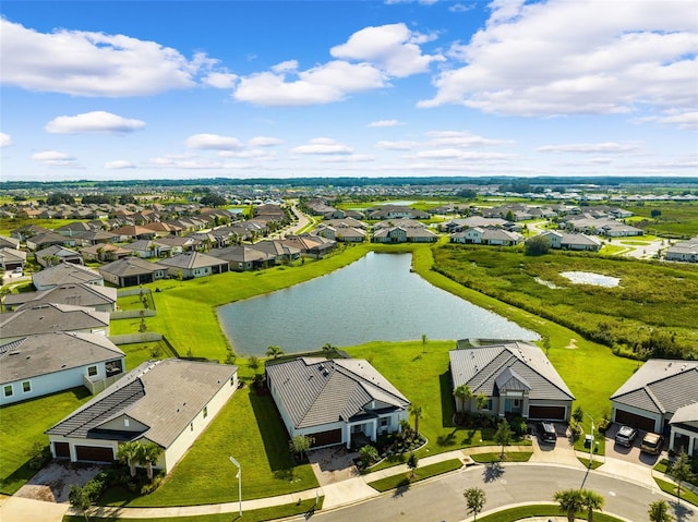 drone / aerial view with a water view