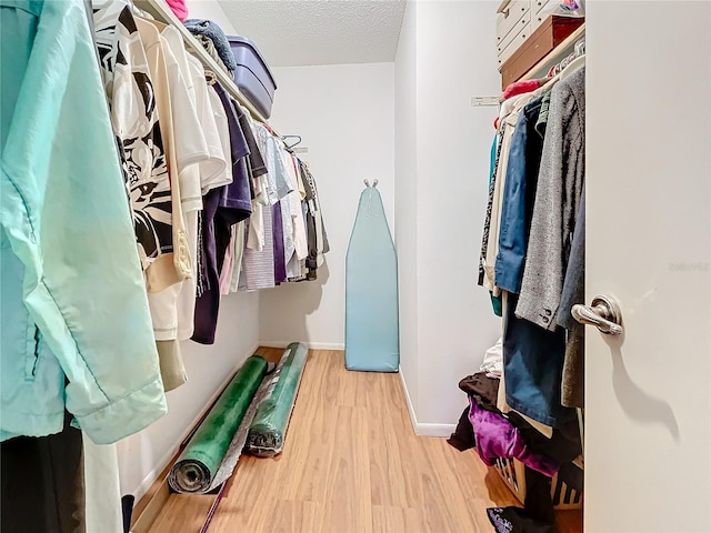 walk in closet featuring light wood-type flooring