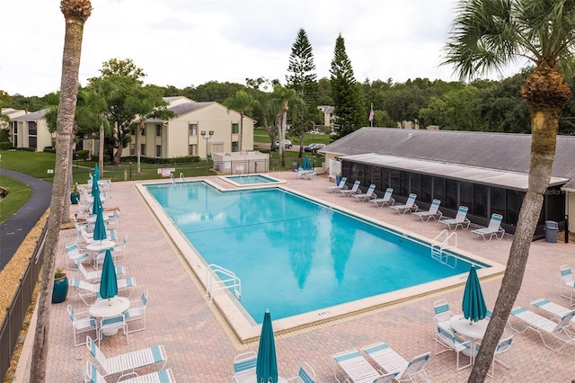 view of swimming pool with a patio