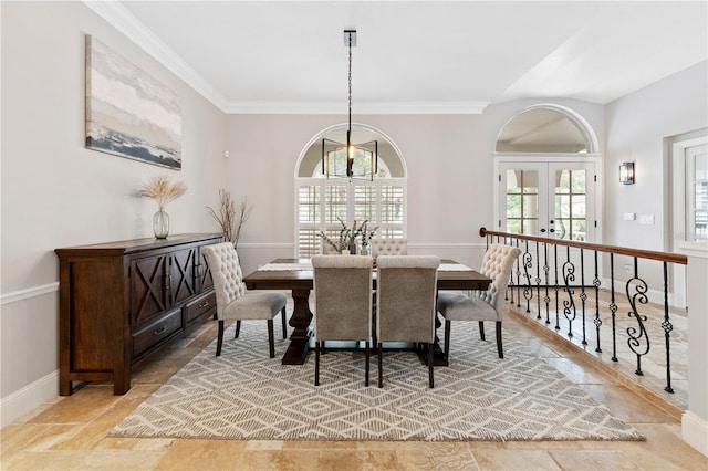 dining room with ornamental molding, french doors, and baseboards