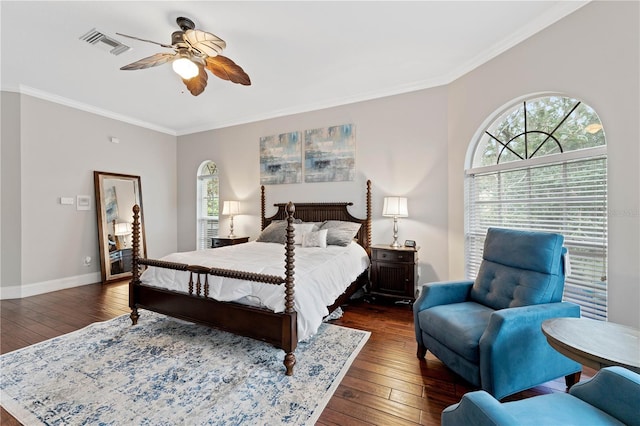 bedroom with ornamental molding, multiple windows, and visible vents