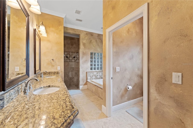 bathroom with visible vents, a sink, baseboards, and a bath