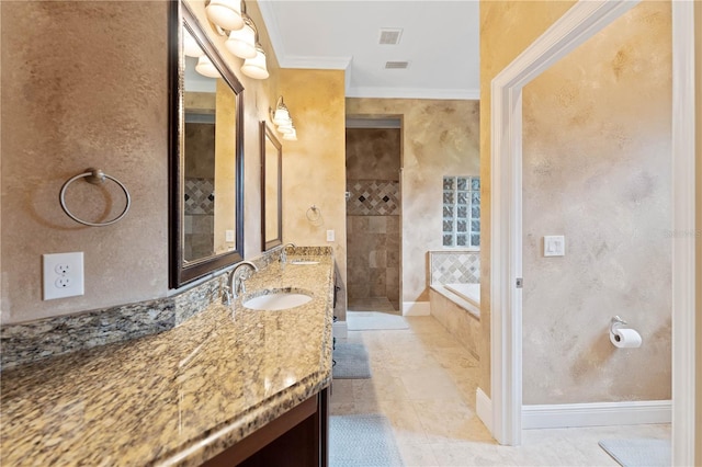 full bath with a bath, baseboards, crown molding, and vanity