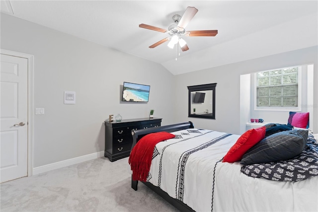 bedroom featuring vaulted ceiling, ceiling fan, carpet flooring, and baseboards