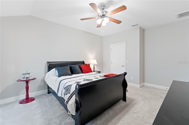 bedroom featuring baseboards, visible vents, and light colored carpet