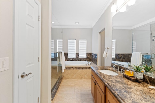 bathroom with tile patterned flooring, a garden tub, vanity, ornamental molding, and a stall shower