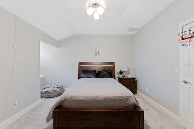 bedroom with lofted ceiling, carpet, visible vents, and baseboards