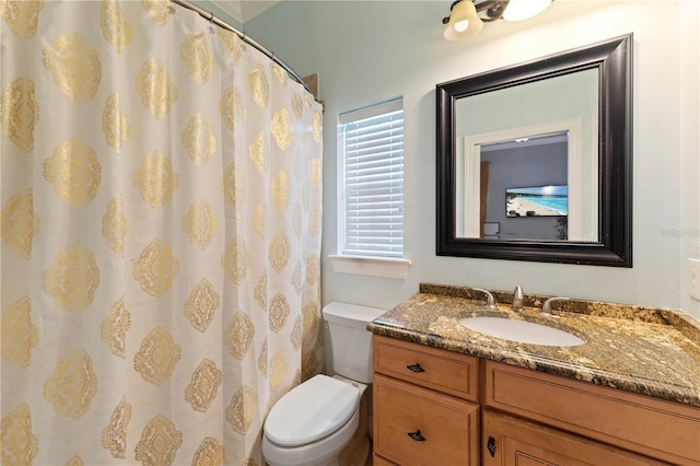 full bathroom with vanity and toilet