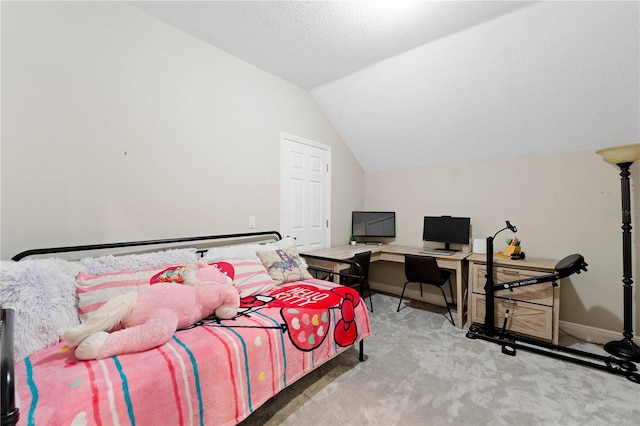 carpeted bedroom with baseboards, vaulted ceiling, and a textured ceiling