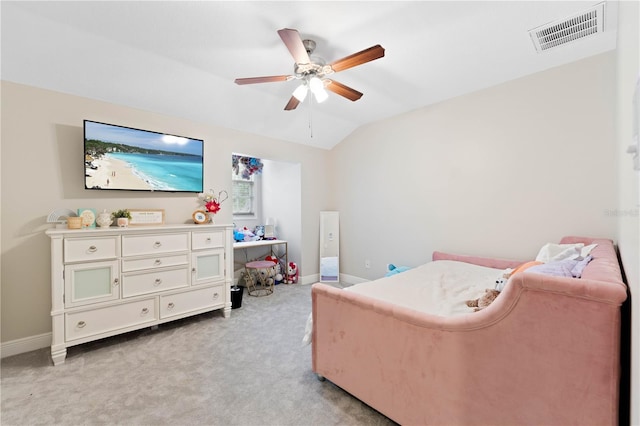 bedroom with lofted ceiling, baseboards, visible vents, and light colored carpet