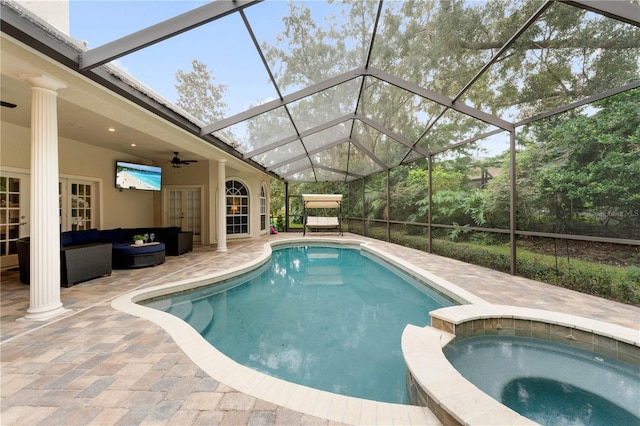 view of pool featuring ceiling fan, french doors, a patio area, a pool with connected hot tub, and outdoor lounge area