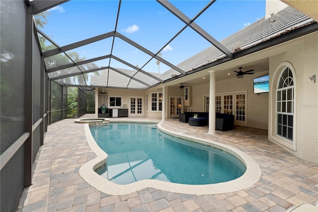 view of pool featuring french doors, a patio, a pool with connected hot tub, ceiling fan, and a lanai