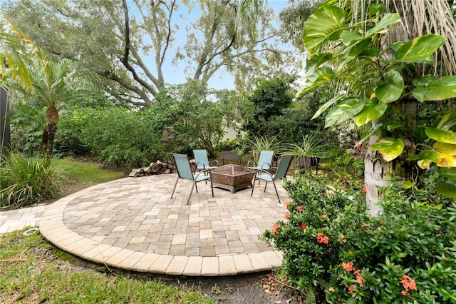 view of patio with a fire pit