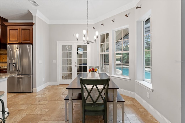 dining area featuring ornamental molding, stone tile flooring, visible vents, and baseboards