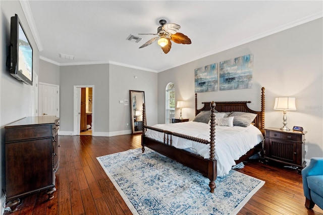 bedroom featuring ornamental molding, dark wood finished floors, visible vents, and baseboards