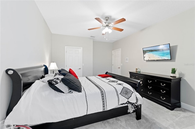 bedroom featuring carpet floors, visible vents, and a ceiling fan