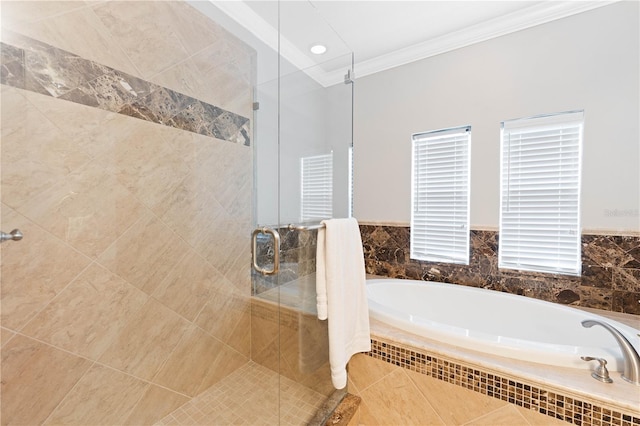 bathroom with ornamental molding, a garden tub, and a shower stall