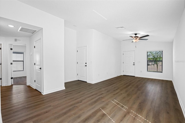 unfurnished living room with lofted ceiling, dark hardwood / wood-style flooring, and ceiling fan