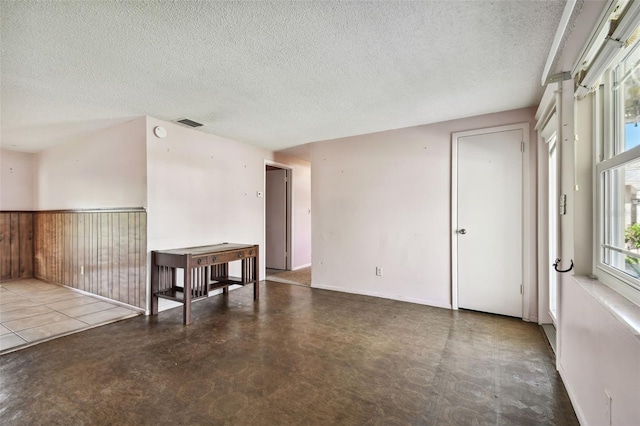 empty room with a textured ceiling