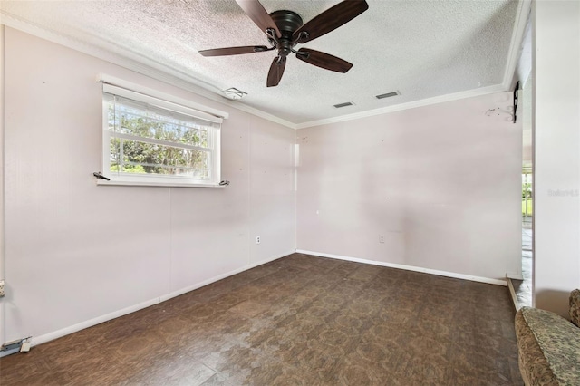 spare room with ceiling fan, a textured ceiling, and crown molding