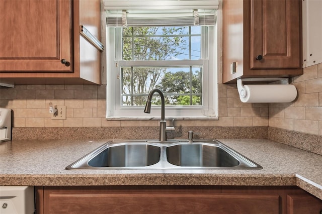 kitchen with tasteful backsplash and sink