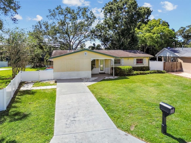 single story home featuring a front yard