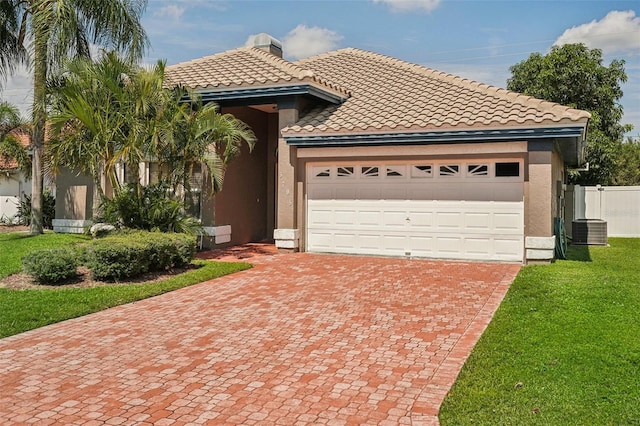 view of front facade featuring a garage and a front lawn