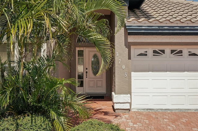 entrance to property featuring a garage