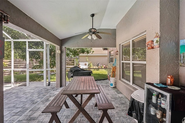 view of patio / terrace with a lanai and ceiling fan