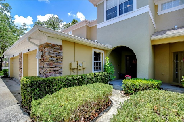 view of exterior entry featuring a garage