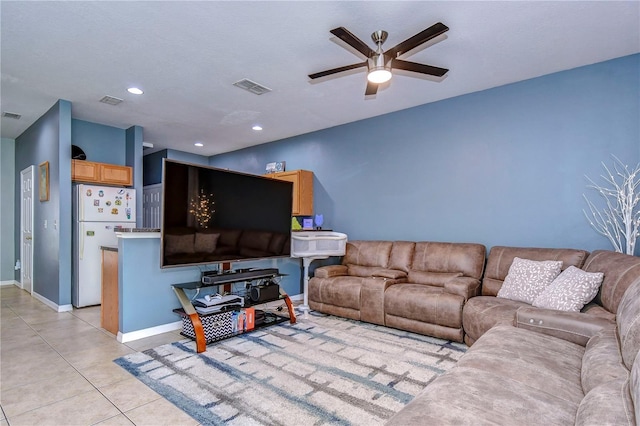 tiled living room with ceiling fan