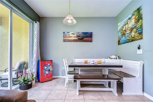 tiled dining space featuring breakfast area