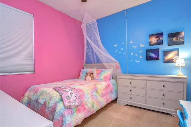 carpeted bedroom featuring lofted ceiling