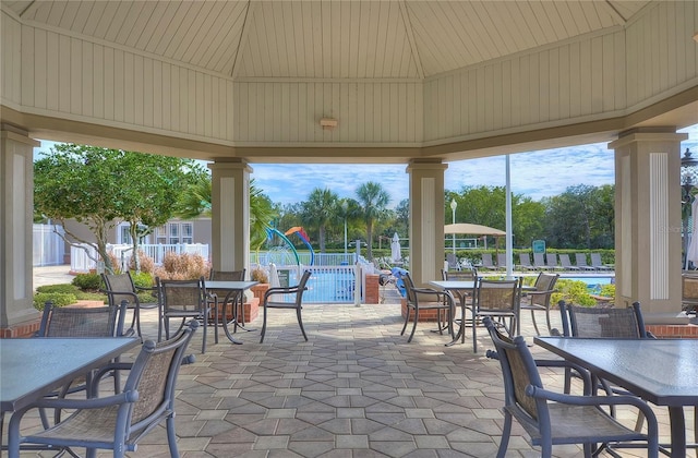 view of patio / terrace featuring a gazebo and a community pool