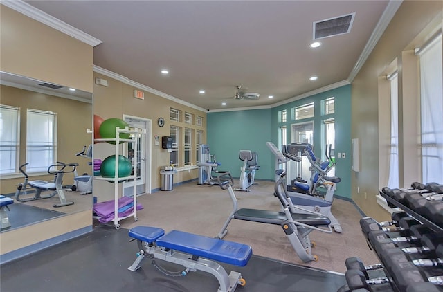 gym with ornamental molding and ceiling fan