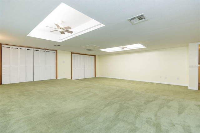 interior space featuring carpet and ceiling fan