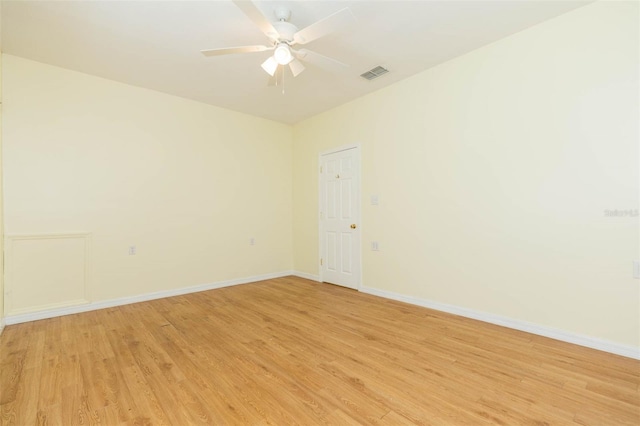 spare room featuring light wood-type flooring and ceiling fan