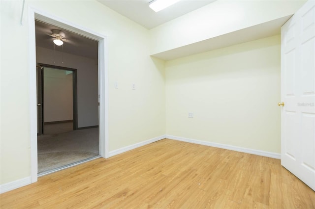 unfurnished room with ceiling fan and hardwood / wood-style floors