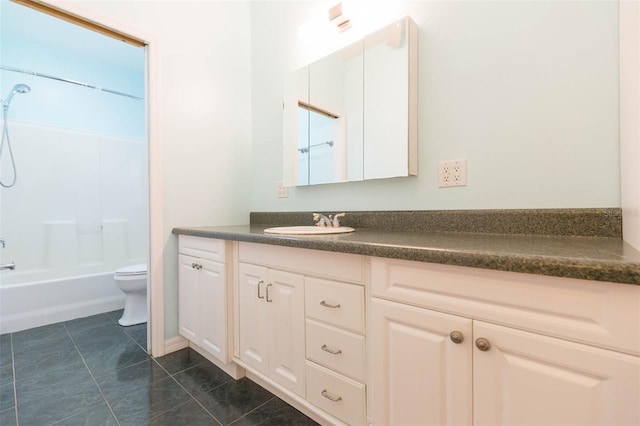 full bathroom featuring vanity, bathtub / shower combination, toilet, and tile patterned floors