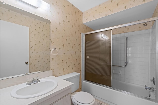 full bathroom with bath / shower combo with glass door, vanity, and toilet