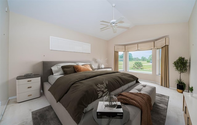 bedroom featuring light colored carpet, baseboards, ceiling fan, and vaulted ceiling